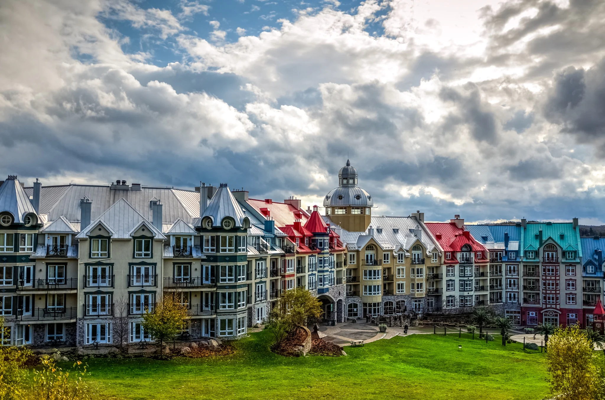 Boutique village residences with dramatic sky
